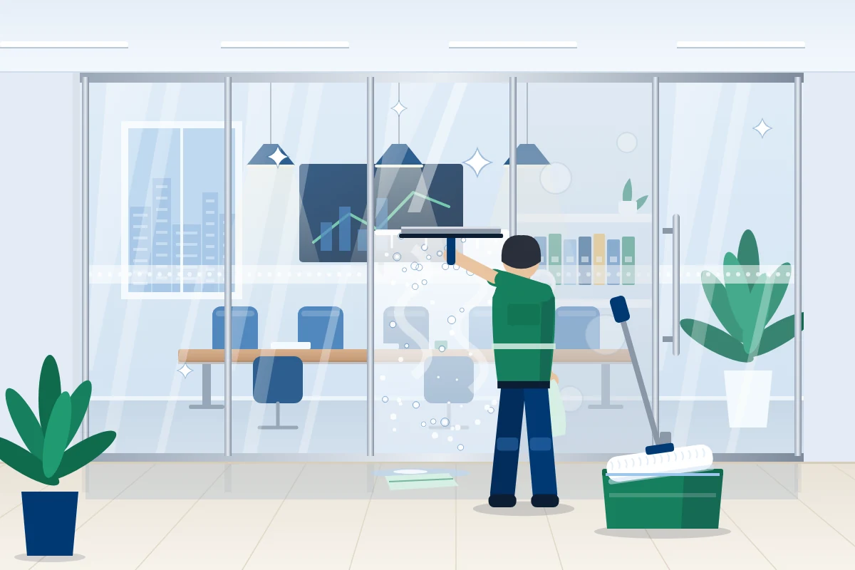 Glasreinigung im Büro: Glastrennwand wird mit dem Abzieher streifenfrei gereinigt