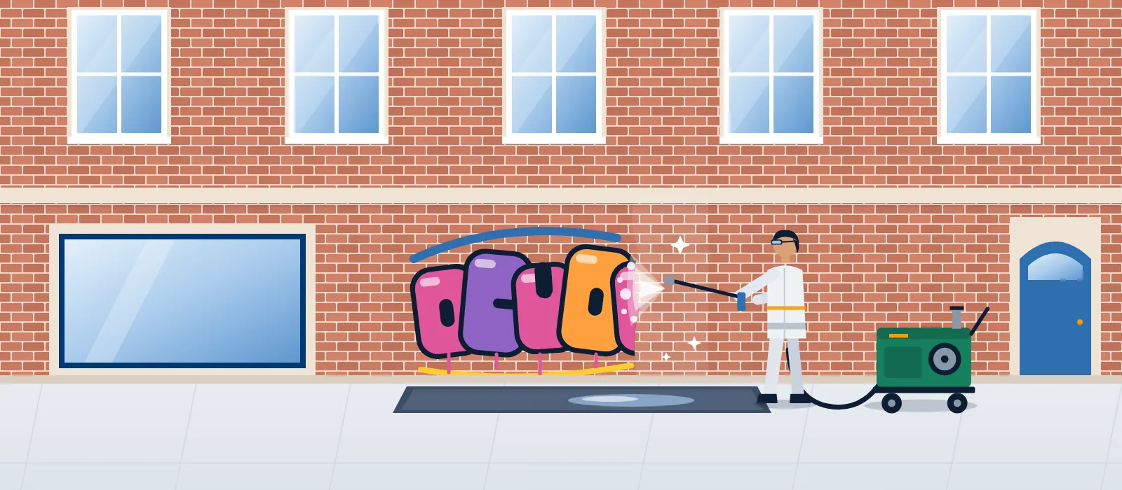 Graffiti an der Klinkerwand Fachkraft entfernt mit Heißwasserlanze einen Farbschriftzug von einer Klinkerfassade, die gereinigte Hälfte ist bereits sauber